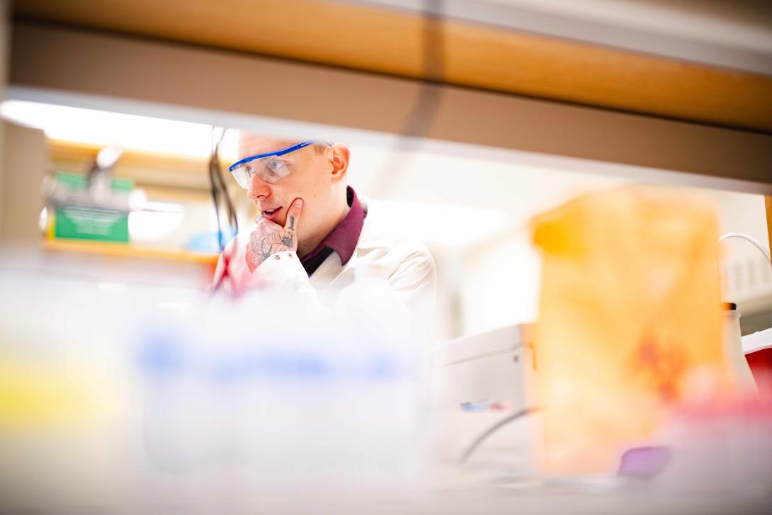 Laverty in the lab wearing a lab coat.